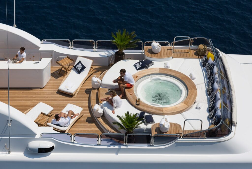 guests relaxing in the yacht jacuzzi lounge