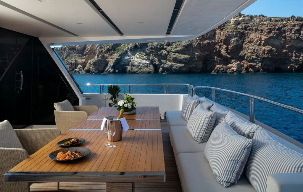 dining table on the yacht aft deck with sofa & 2 chairs