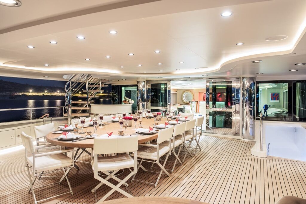 dining table for up to 12 guests on the yacht upper deck