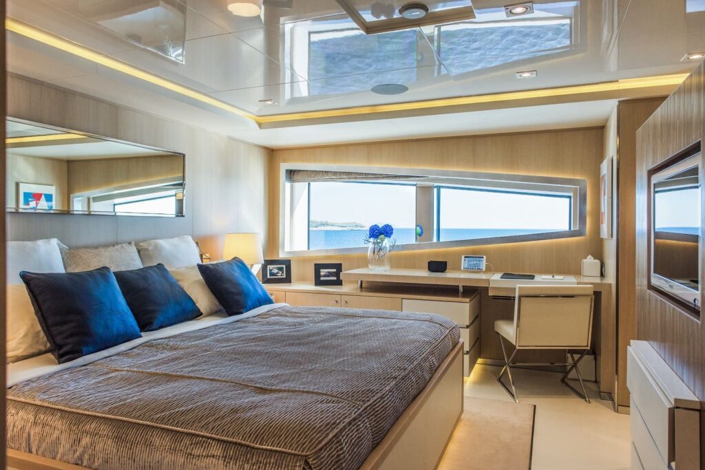 double cabin on the yacht upper deck with a work desk
