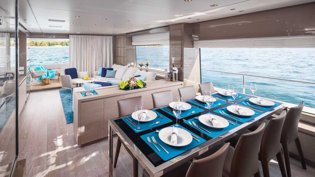 dining table & main salon view onboard secundus motor yacht