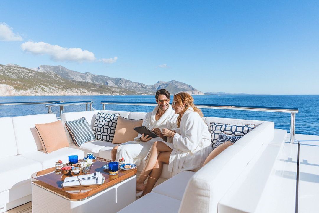 people enjoying breakfast on the yacht sundeck