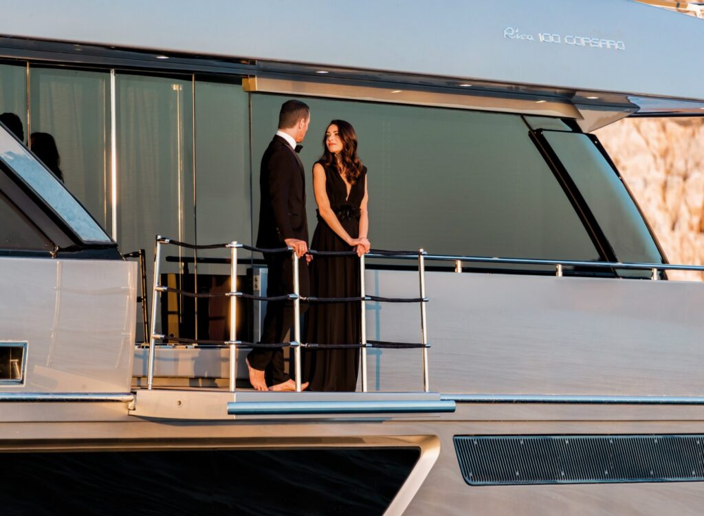 Nikita Yacht Charter couple on the balcony