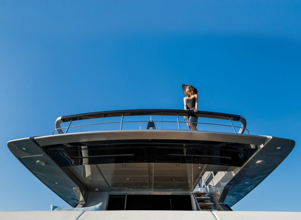 Nikita Yacht Charter lady on the flybridge aft