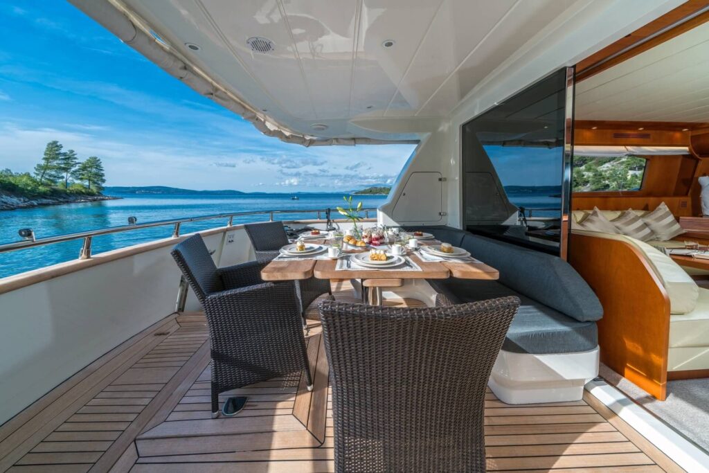 jantar yacht charter aft deck dining table