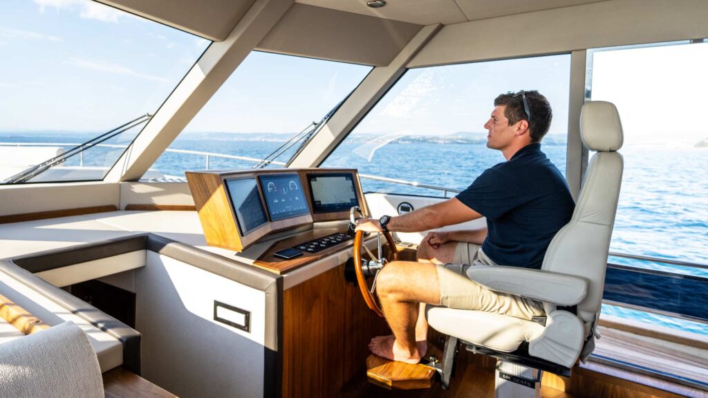 panta rei yacht charter captain in the helm area