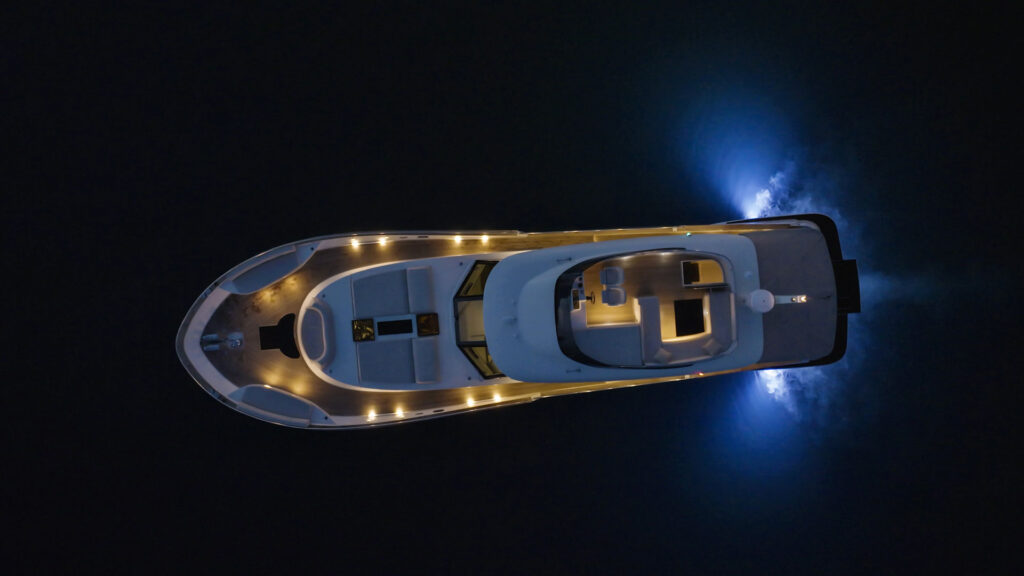 panta rei yacht charter with lights on at night