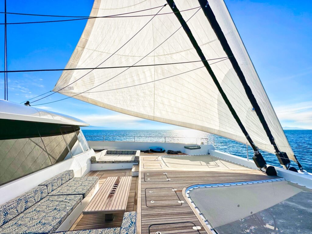 nala one catamaran yacht bow area with sails
