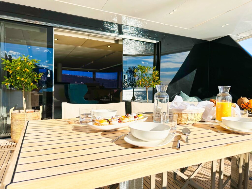 nala one catamaran yacht outdoor dining table