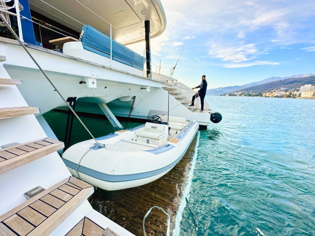 nala one catamaran yacht tender on a swimming platform