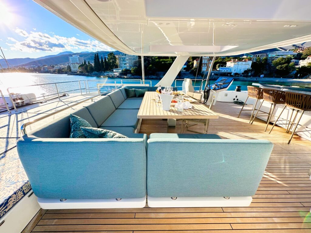 nala one catamaran yacht sundeck lounge with diining table