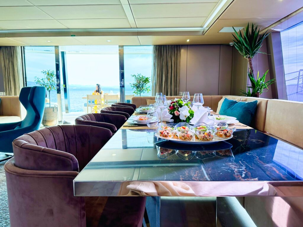 nala one catamaran yacht appetizers in the main salon dining