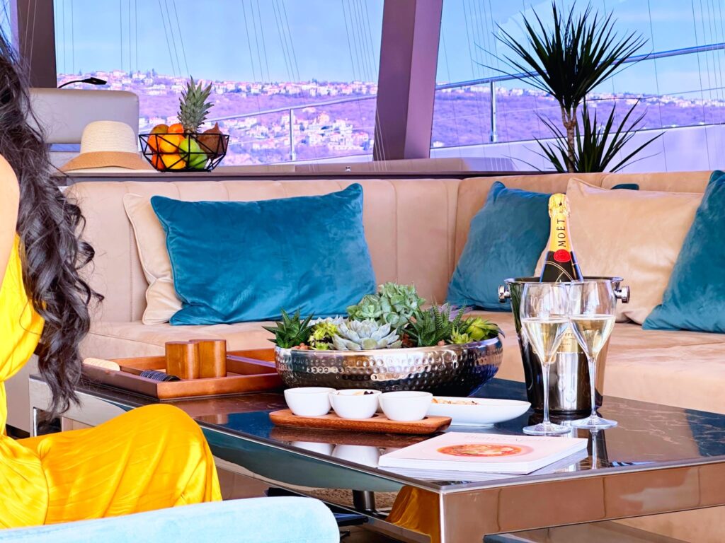 nala one catamaran yacht champagne and snacks in the main salon