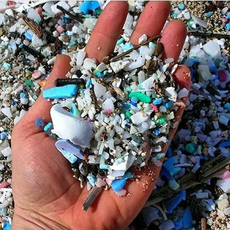 Hand filled with plastics