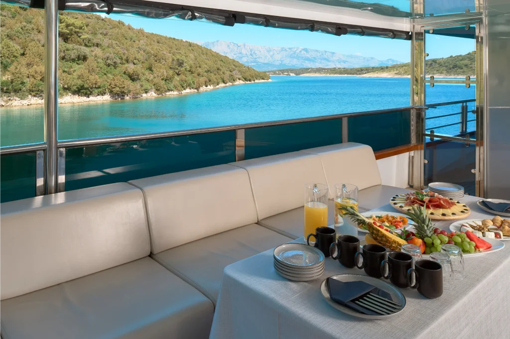 cristal yacht charter breakfast on the bridge deck