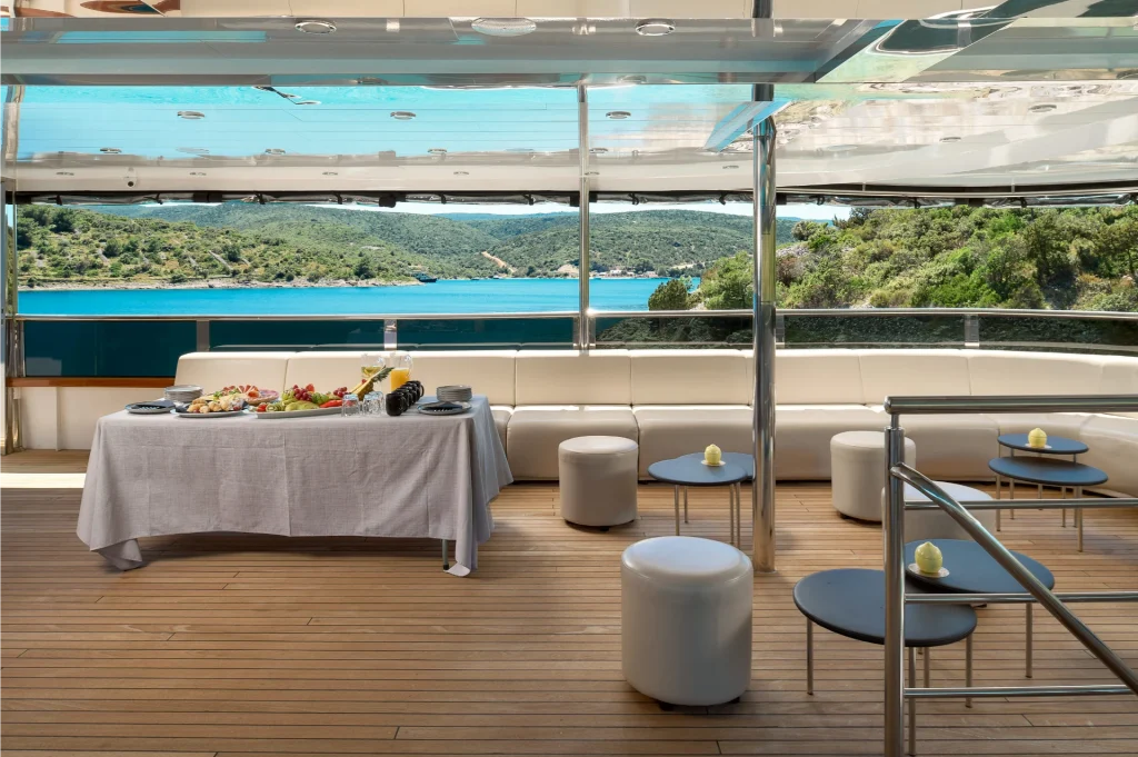 cristal yacht charter catering table and lounge area