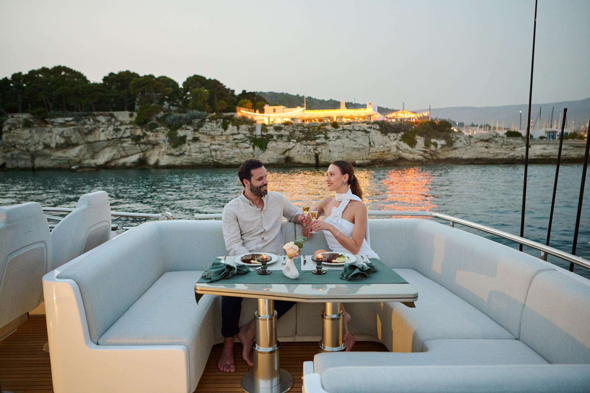 myne yacht charter dining at sunset