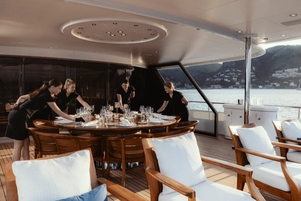 adventure yacht charter crew setting the table